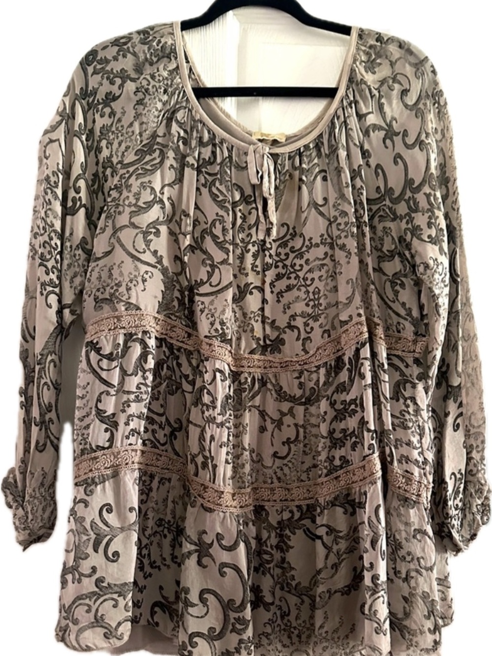 Grey/black top. Never worn . size small . can fit up to a large